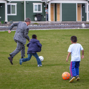 Paul Purcell, President of Beacon, playing soccer with children at Casa Kino.