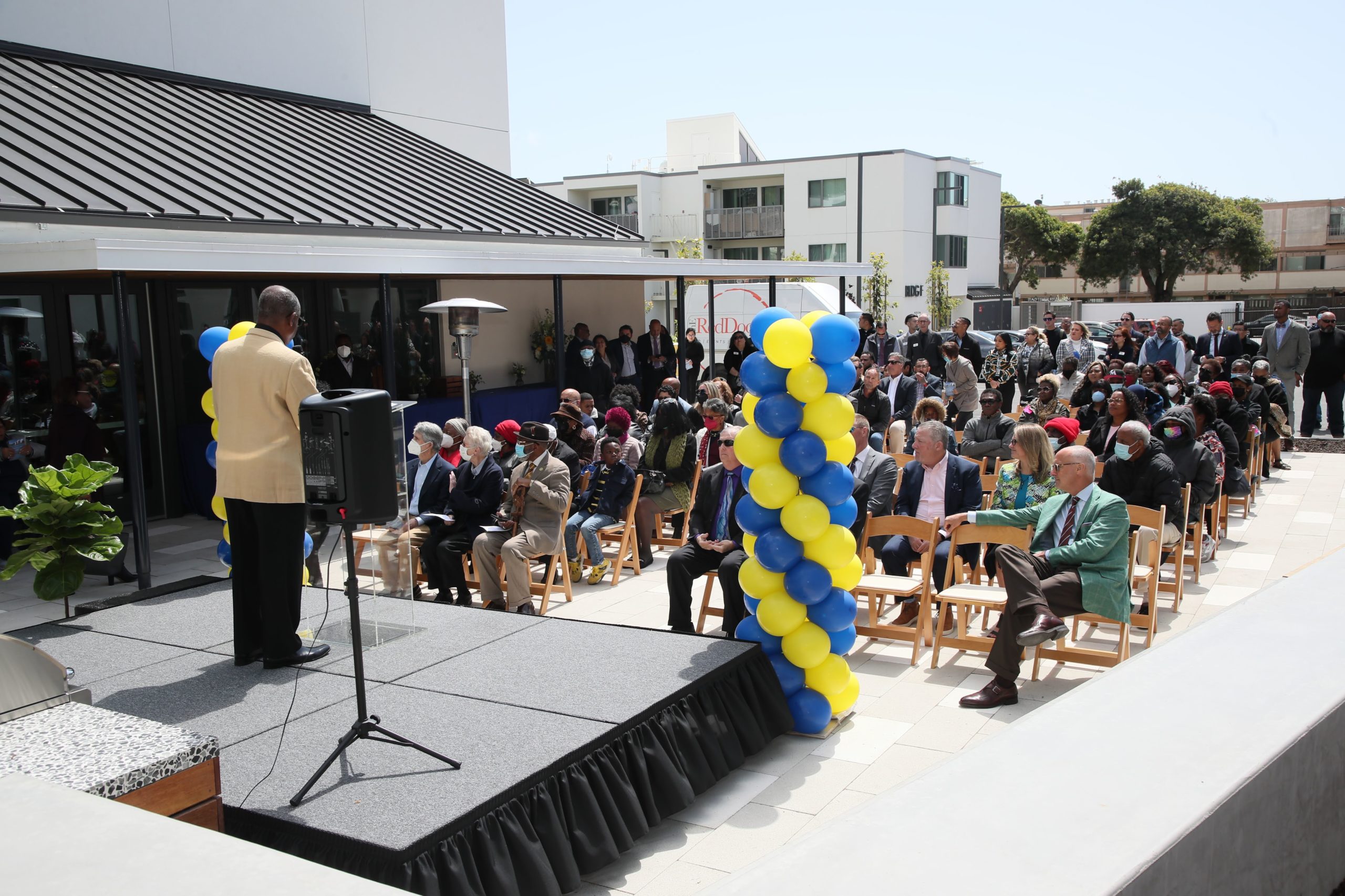 Grand Opening Event in front of newly renovated community room and bbq patio area.